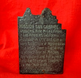 Bronze folding San Gabriel Mission bookends from about 1915 and inscribed back of iron bookends from about 1925. Both are from the Forbes Foundry that morphed into The California Bell Company